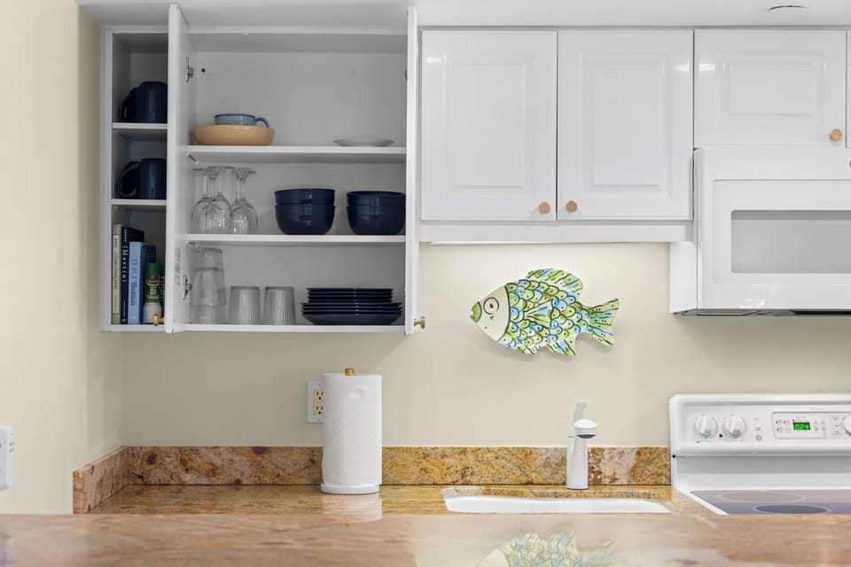 A clean and well-organized kitchen & keurig coffee maker await you.