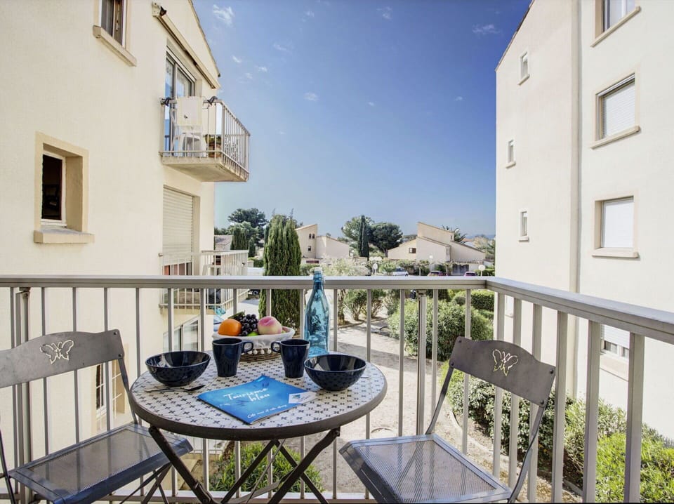 Building, Sky, Table, Window, Plant, Chair, Fence, Outdoor Furniture, Outdoor Table, Urban Design