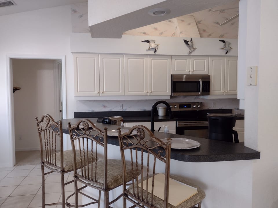 A view of the breakfast bar looking into the kitchen.