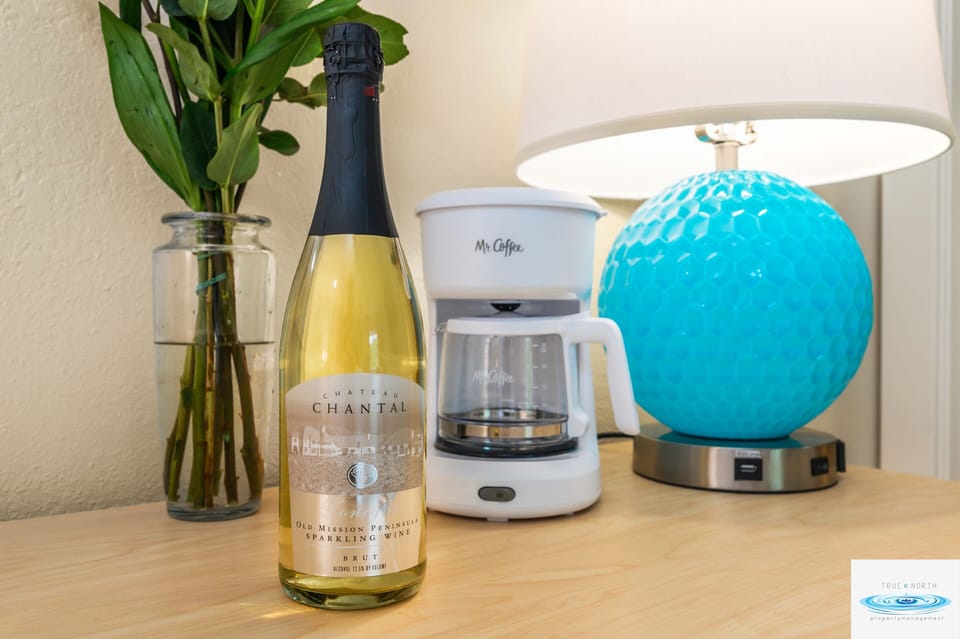 A coffee maker is provided inside the room, adding a thoughtful touch to the cozy ambiance of the space.