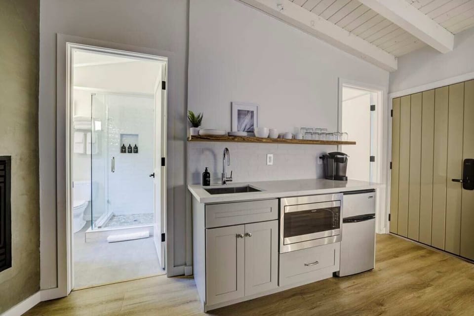 Compact kitchenette: Keurig, microwave, mini fridge. No stove.