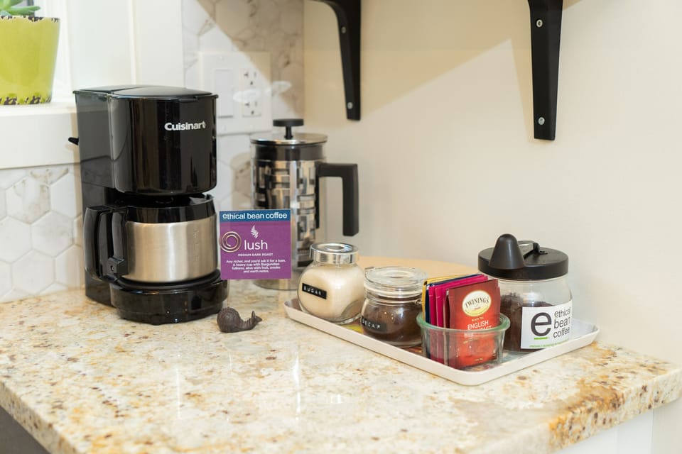 Coffee station featuring ETHICAL BEAN coffee and teas. French Press or drip.