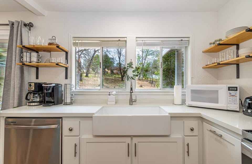 New farmhouse sink, overlooking backyard. 