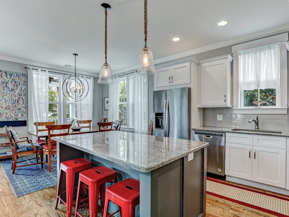 Kitchen features island with seating