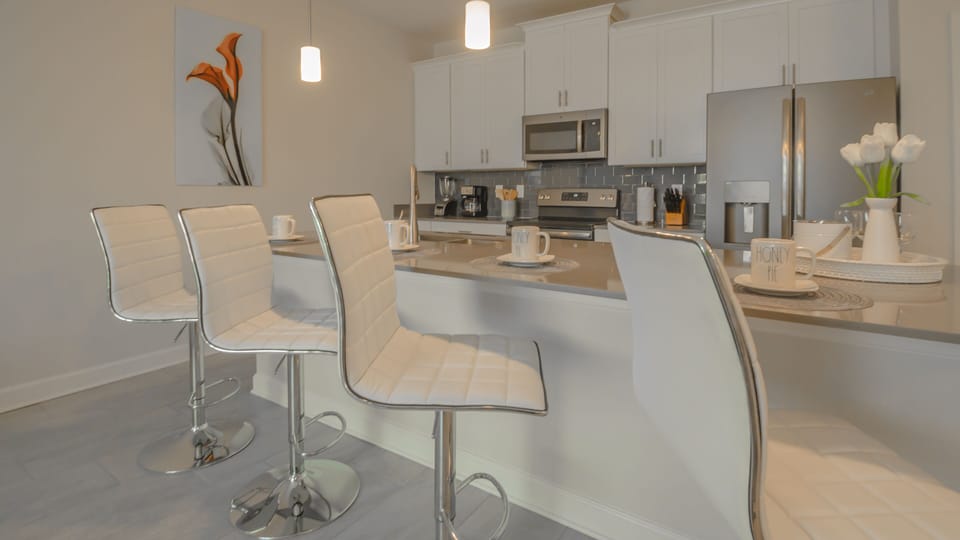 Open kitchen with 4 barstools 