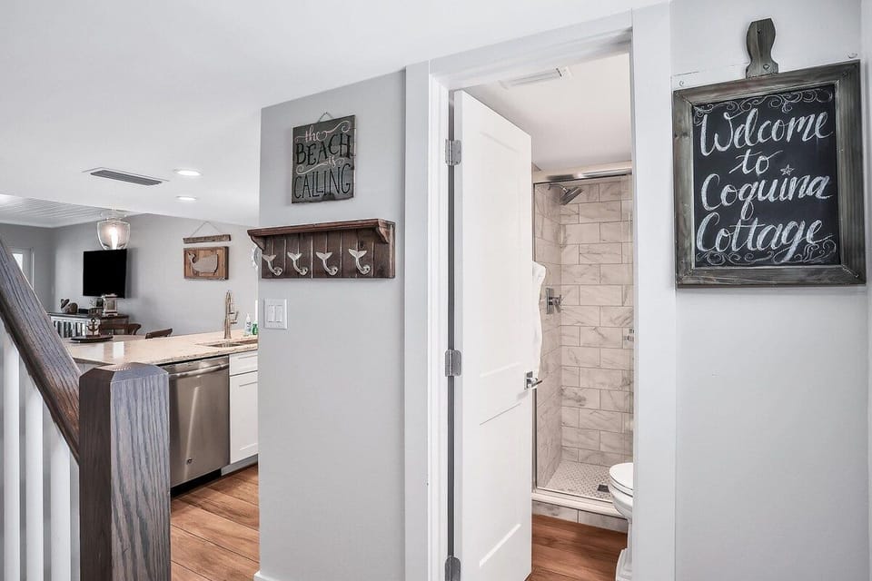 Rinse away the sand and salt in a bright, comfortable bathroom off the kitchen - designed for easy vacation living.