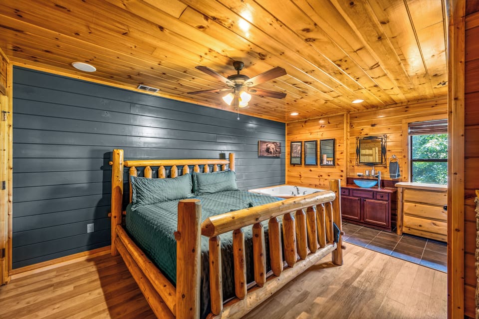 Rustic Master Bedroom Retreat – A cozy log-style bed and warm wood tones