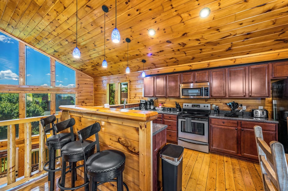 Fully Equipped Kitchen – Stainless steel appliances, wooden accents
