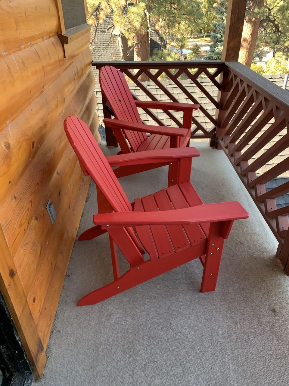 Upstairs master private patio with bistro table and adirondack chairs. Lake view