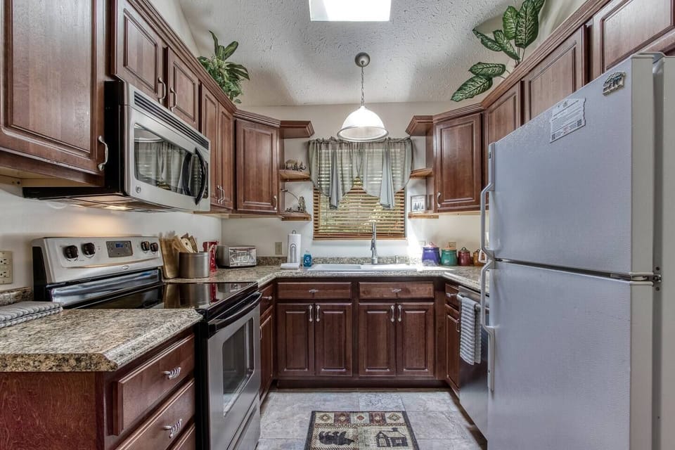 Kitchen fully stocked with all utensils, pots, pans you need for cooking and a coffee maker