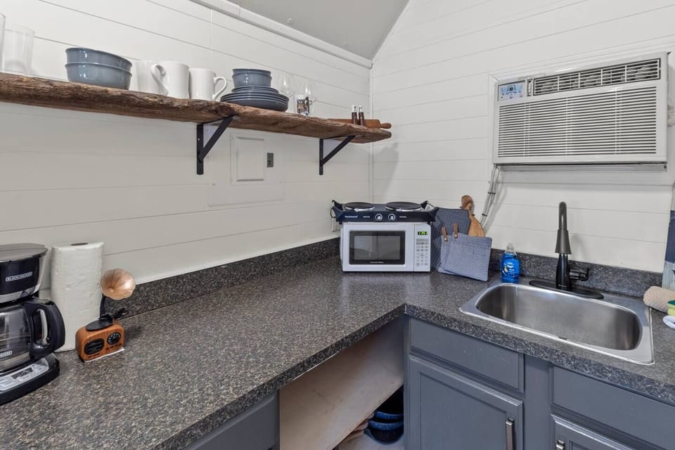 Microwave, 2 burner cooktop with pots & pans & dishes