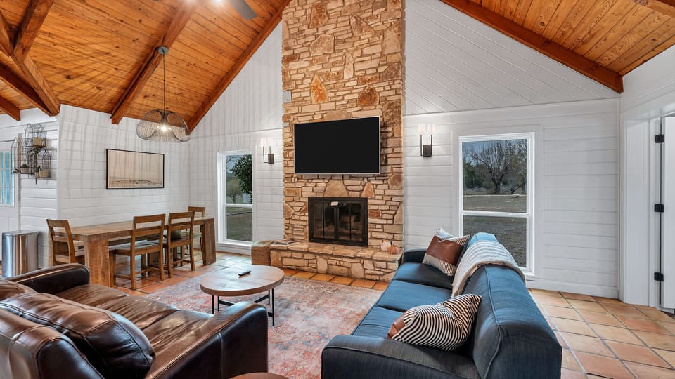 Great room with original stone fireplace.