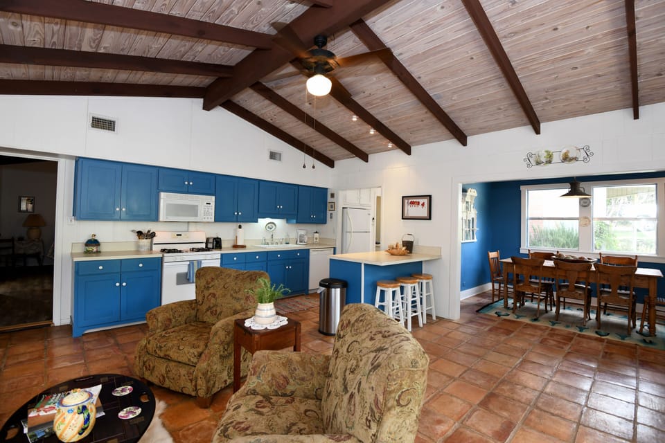 The front living room opens to kitchen and dining room.