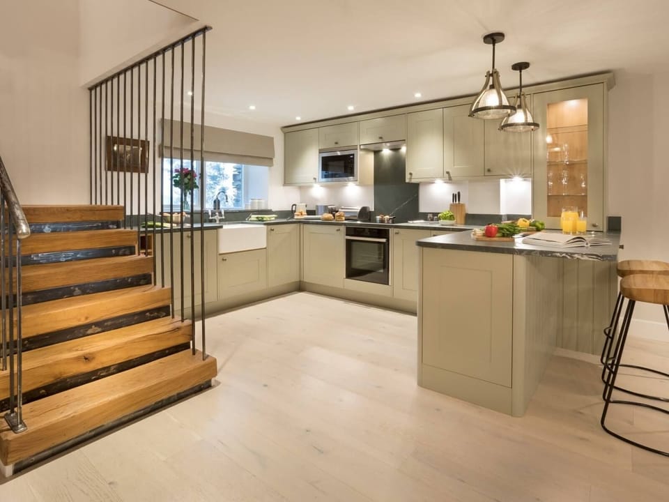 The open plan kitchen and staircase at Shepherd's View, Lake District