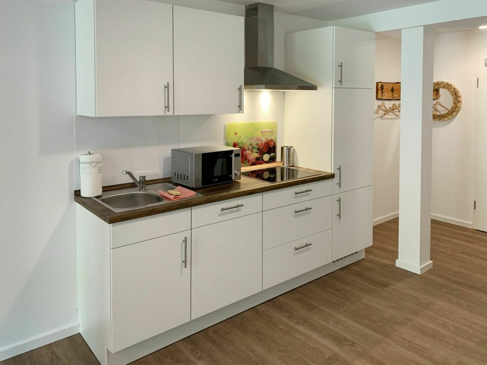 Countertop, Cabinetry, Kitchen, Building, Kitchen Stove, Kitchen Appliance, Drawer, Wood, Home Appliance, Interior Design