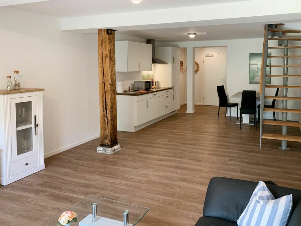 Property, Furniture, Cabinetry, Wood, Lighting, Flooring, Interior Design, Hall, Drawer, Building