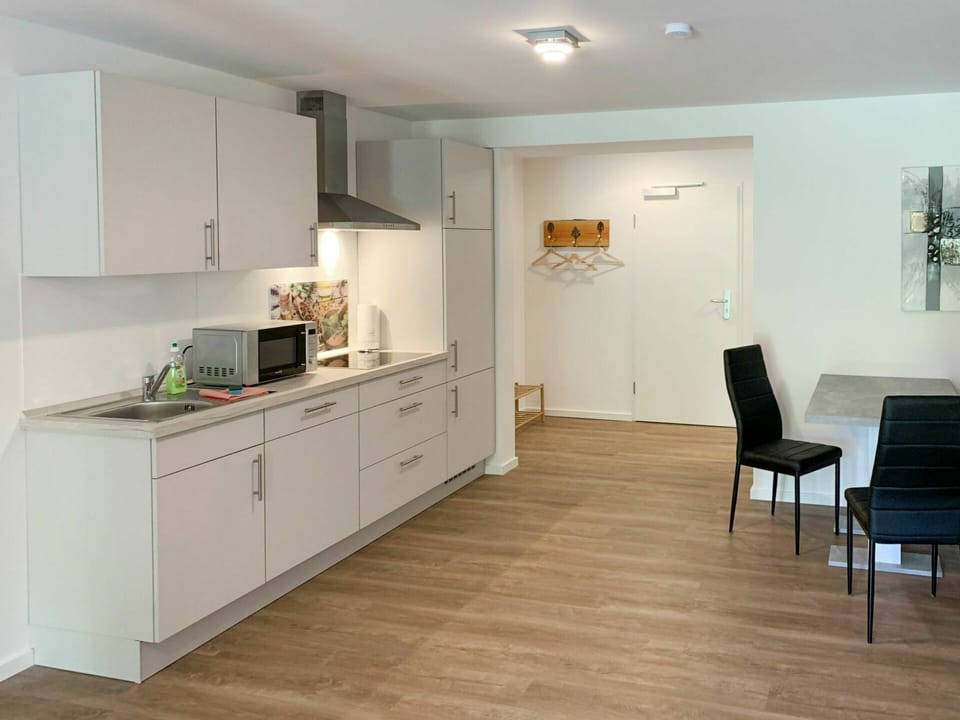 Cabinetry, Furniture, Property, Countertop, Chair, Building, Drawer, Wood, Interior Design, Lighting