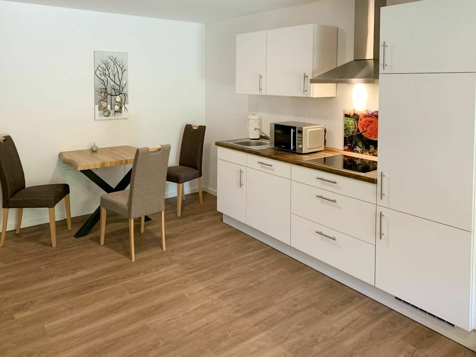 Cabinetry, Countertop, Furniture, Kitchen Stove, Chair, Kitchen Appliance, Wood, Kitchen, Building, Drawer