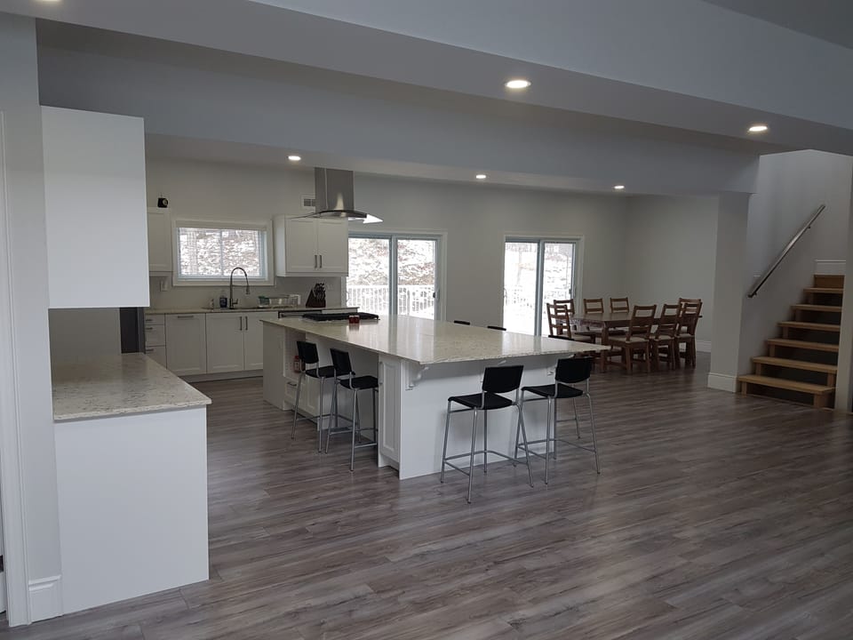 Kitchen and dining room, 500 sq ft deck attached to kitchen through patio doors.