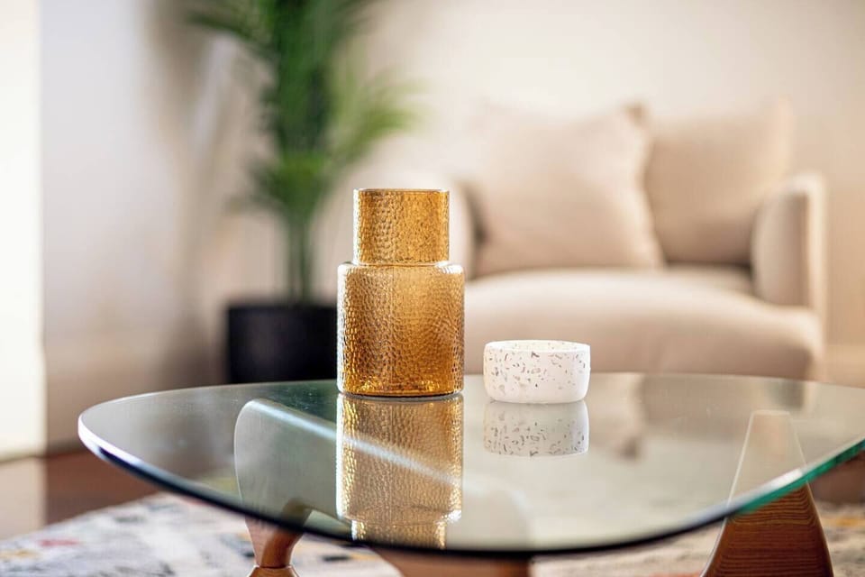 Amber-toned candles add a cozy, inviting glow to the living area.