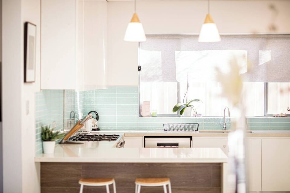 Well-equipped kitchen with gas stove, perfect for home-cooked meals and morning routines.