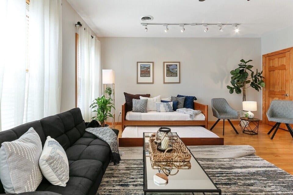 Living room with futon and two twin trundle beds