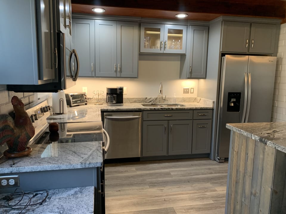 Fully equipped kitchen with stainless appliances.