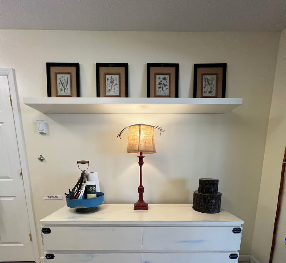 Dresser has extra blankets, bibs, hand towels, wash cloths, TP, paper towels. 