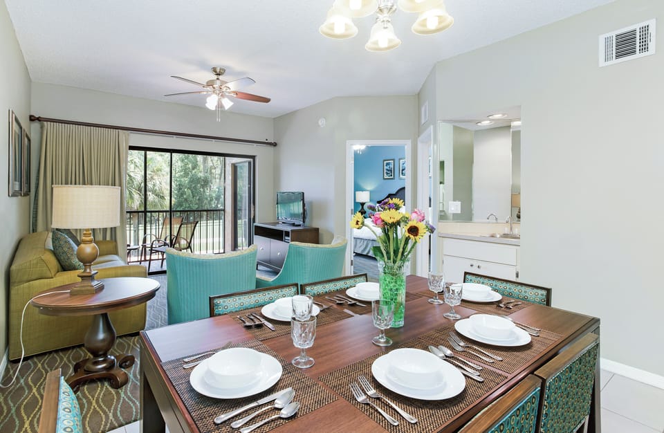 Enjoy family-style dinners with a bright, open kitchen pass-through.