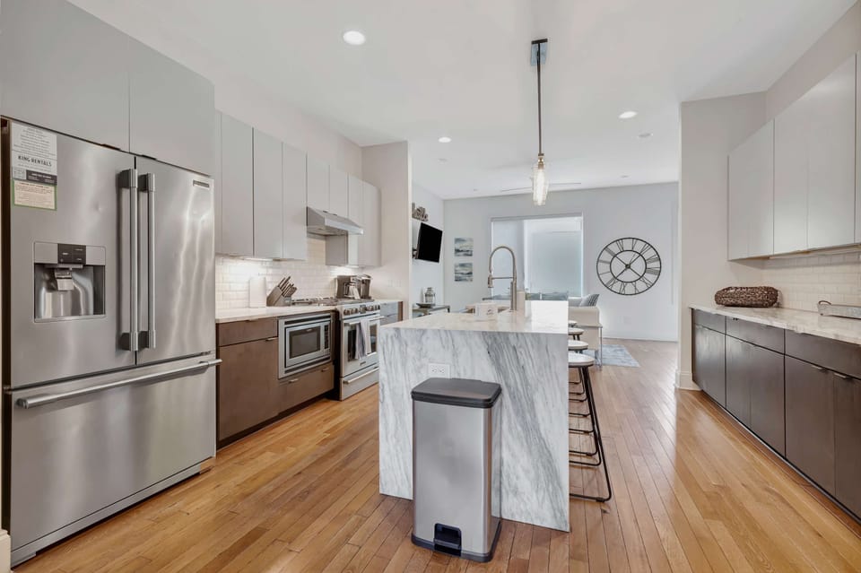 Bright, full kitchen with center island and ample storage—designed for comfort and convenience
