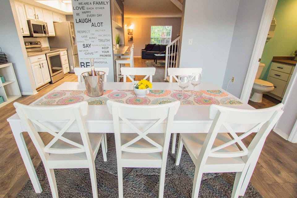 Open floor plan with kitchen/dining area, bar, work space area, half bath and living area!