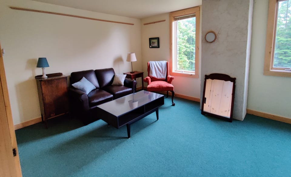 The other end of the Master Bedroom! Comfy twin sized couchbed. Queen bed also.