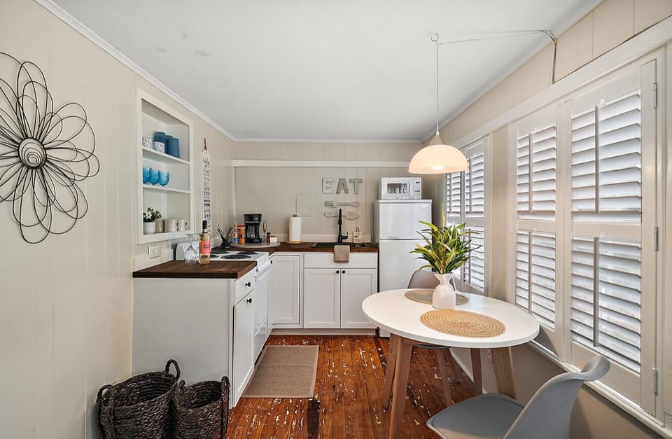 The kitchen is stocked with essential cookware, utensils, and appliances.