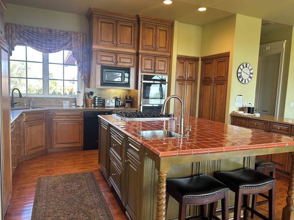 Spacious gourmet kitchen attached to family room and breakfast eating area