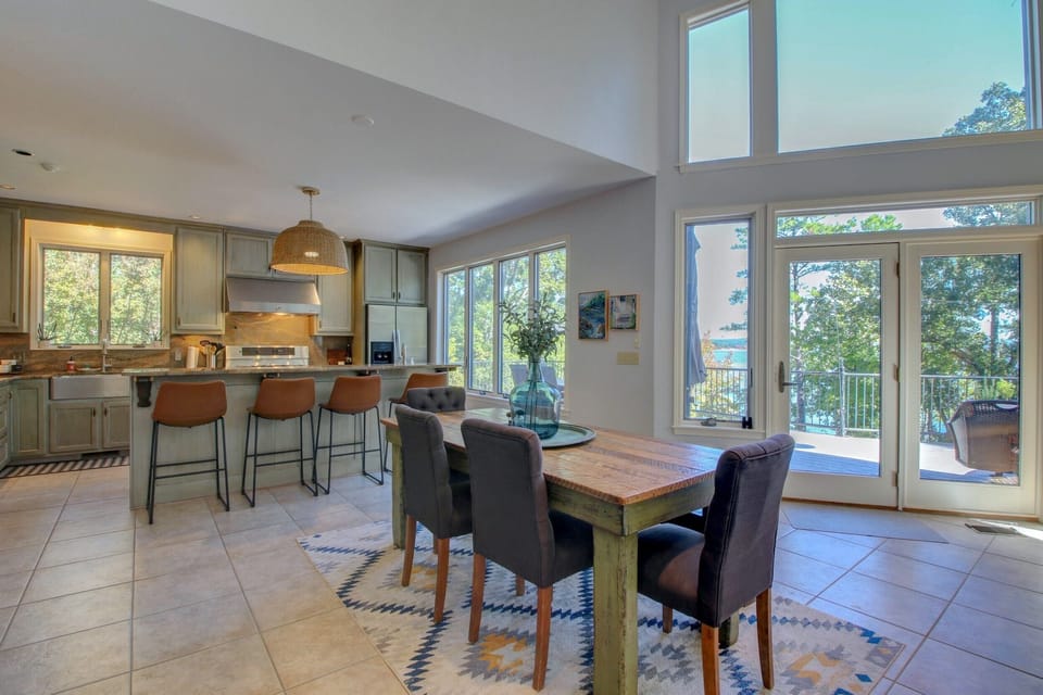 Plenty of seating in the open living, dining, kitchen - all with lake views. 