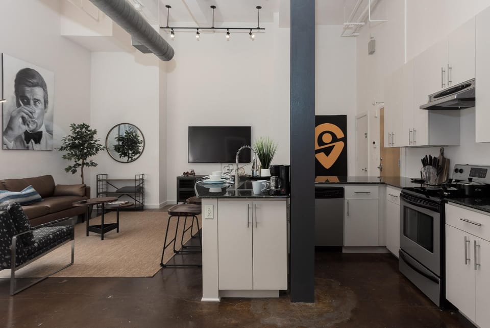 Cook and entertain in a sleek, fully-equipped kitchen featuring modern appliances, ample counter space, and all the essentials for a seamless dining experience in the heart of Fort Worth.