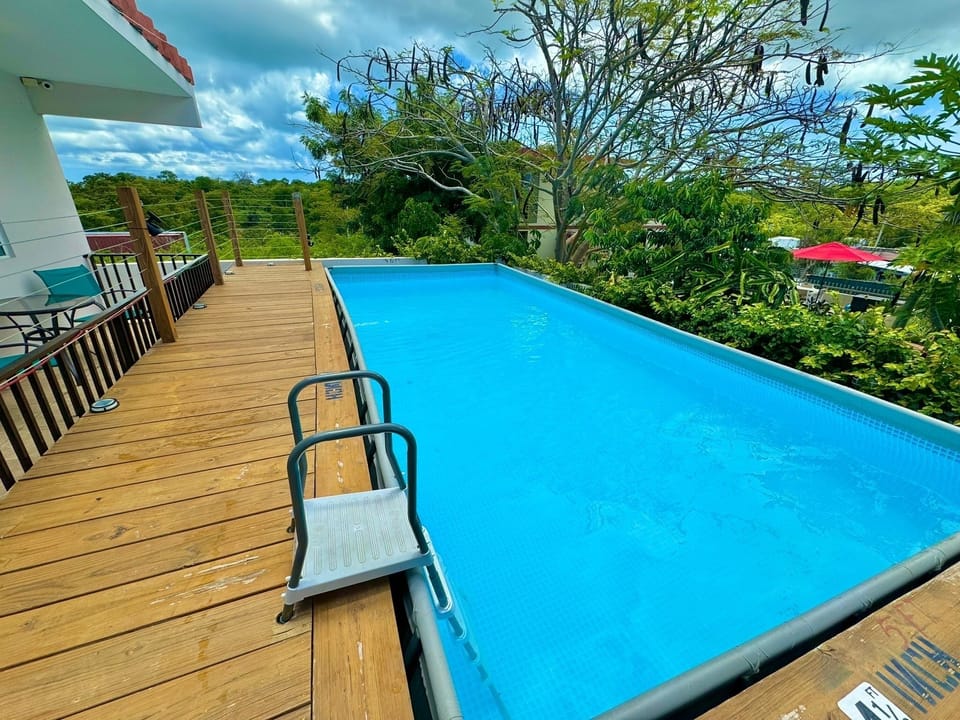 Pool area - 41/2 feet depth.  Attached pool deck w 6 lounge chairs.  