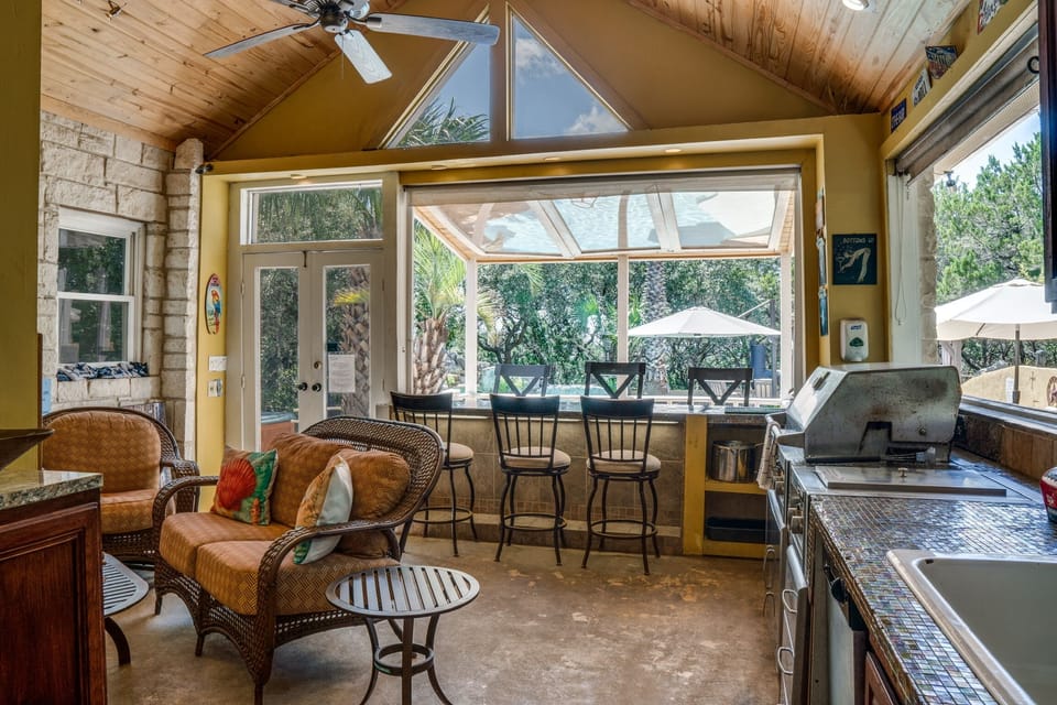 Pool Cabana with indoor/outdoor bar seating and full kitchen, fireplace, washer