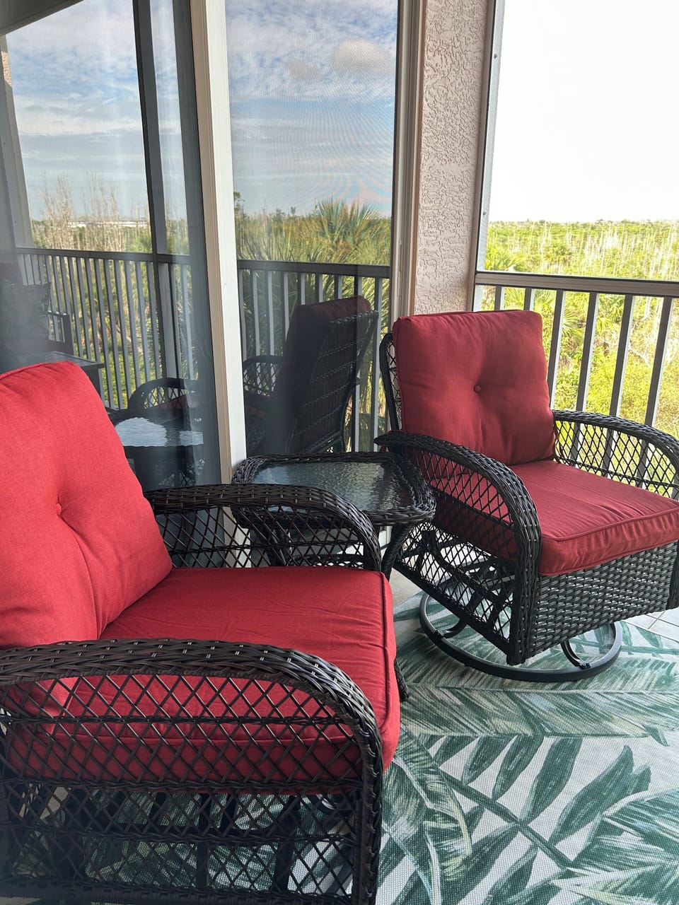 Enjoy a peaceful cup of coffee or glass of wine on this private lanai