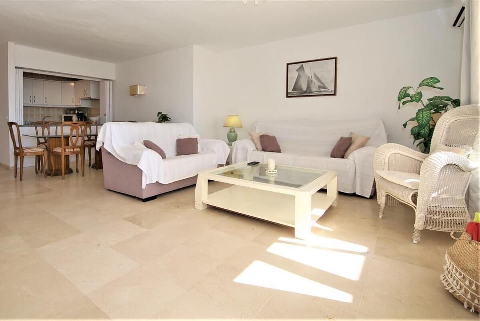 Full view of the lounge area with dining area and kitchen to the rear