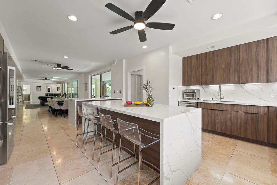 Open kitchen layout connecting seamlessly to living areas, keeping everyone together.