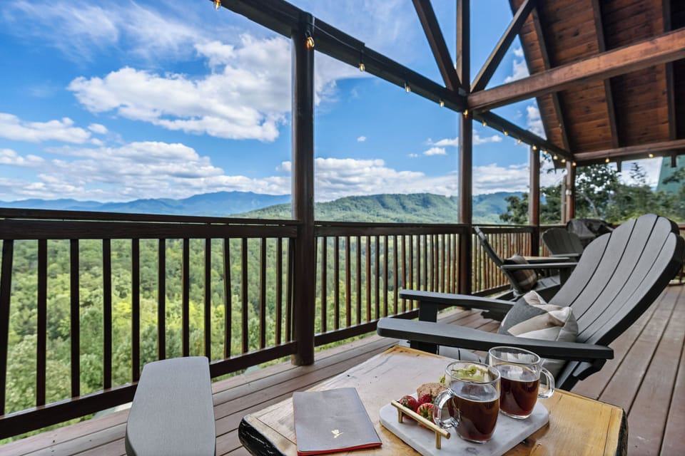 Rocking chairs facing breathtaking mountain scenery