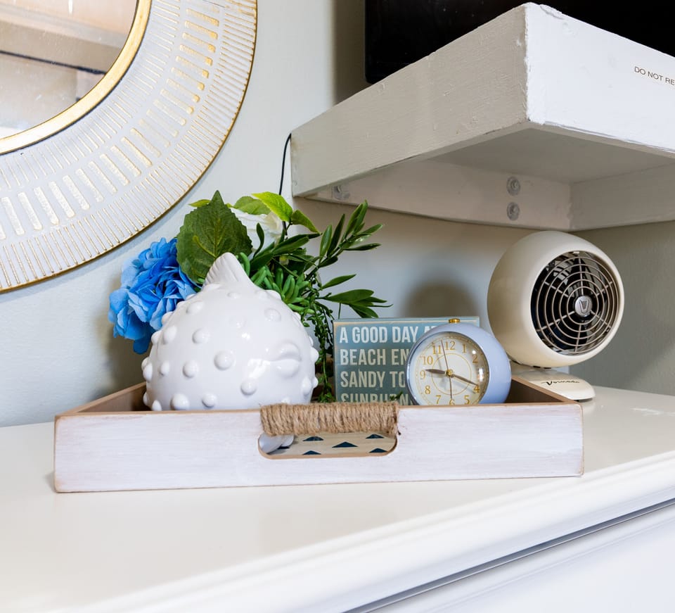 Both bedrooms include a clock, fan and some flowers for the romantics.  