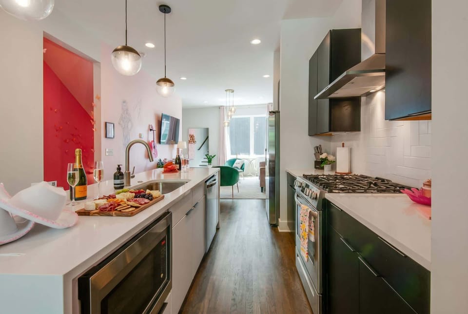 Step into this chic Downtown Nashville kitchen, perfect for hosting gourmet dinner parties with friends. This stylish vacation rental offers luxury and comfort for memorable getaways, making it ideal for bachelorette parties or family reunions!