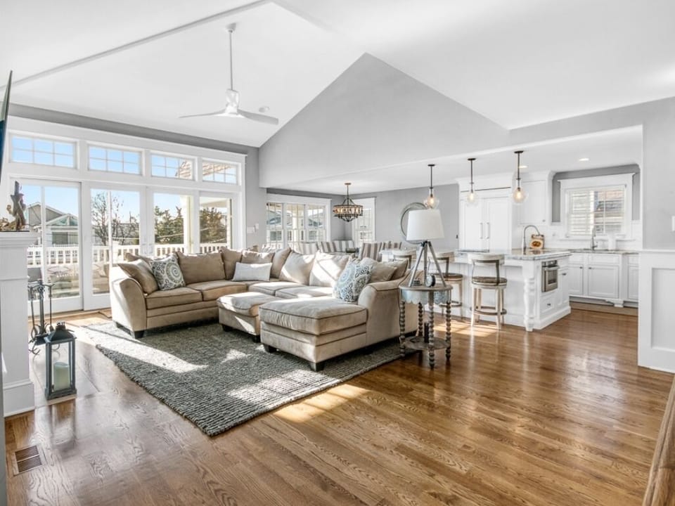 living room off kitchen and deck area