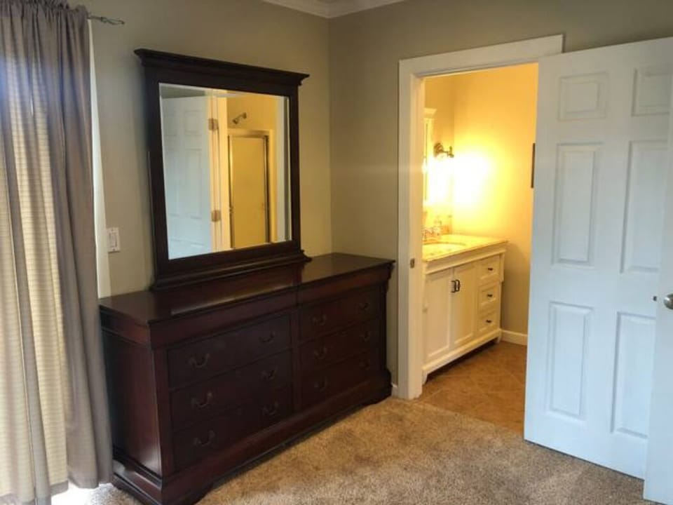 The master bedroom en suite bathroom has a walk-in shower. 
