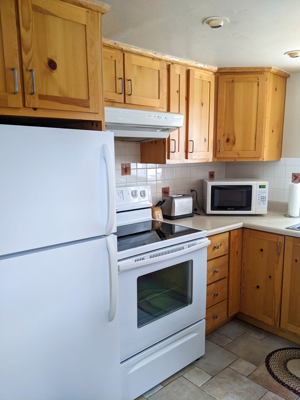 Full Kitchen with stove/oven, microwave, & dishwasher.