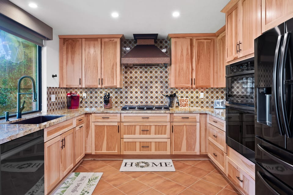 Kitchen comes fully equipped with an auto espresso machine. 