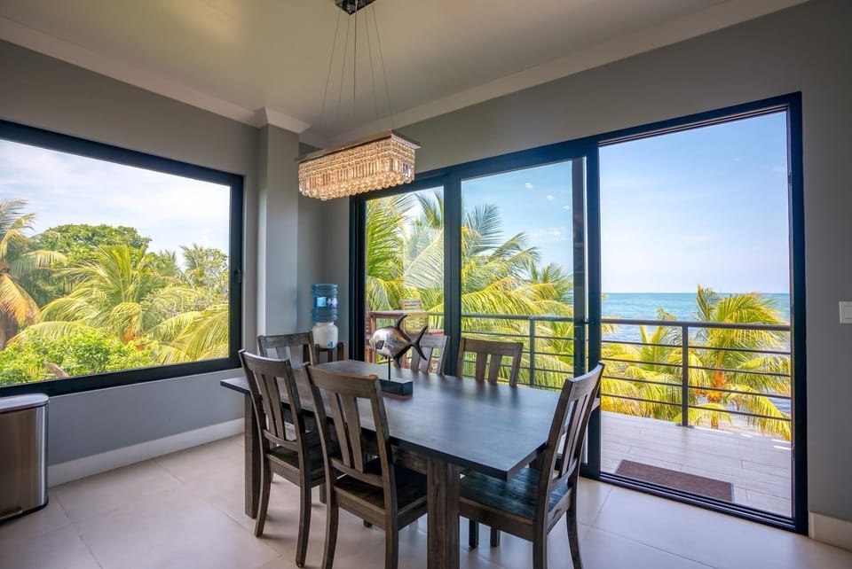 Dining table with balcony sliding door behind.