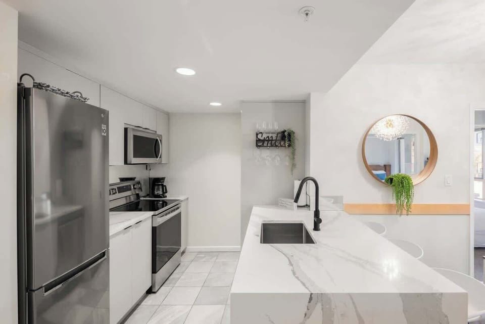 Sleek and modern, well-equipped kitchen.